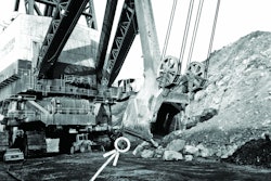 The biggest of the big: Marion’s 6360 The Captain, the largest power shovel ever built and the world’s largest land-based mobile machine until even heavier bucket wheel excavators were introduced in Germany in 1978. Note the wheel loader under the power cord takeup reel, and – if you can see them – the walking man (circled) and the operator in his compartment.