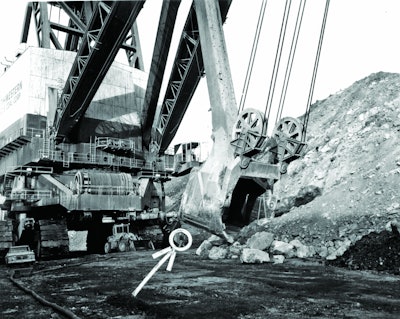 The biggest of the big: Marion’s 6360 The Captain, the largest power shovel ever built and the world’s largest land-based mobile machine until even heavier bucket wheel excavators were introduced in Germany in 1978. Note the wheel loader under the power cord takeup reel, and – if you can see them – the walking man (circled) and the operator in his compartment.