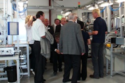 Explaining lean manufacturing cells to attendees at Grote Europe's Opening Ceremonies.