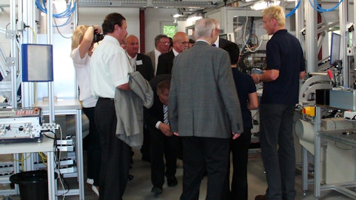 Explaining lean manufacturing cells to attendees at Grote Europe's Opening Ceremonies.