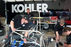 The crew working on the KOHLER engine.