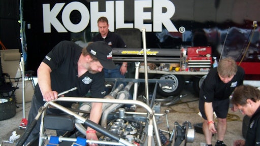 The crew working on the KOHLER engine.