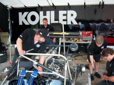 The crew working on the KOHLER engine.