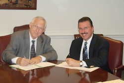 Assistant Secretary of Labor for MSHA Joseph Main (left) and AEM President Dennis Slater (right) at the signing.