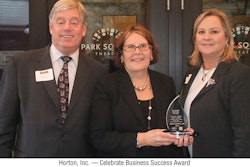 Terry Gilberstadt, center, accepted the Celebrate Business Success Award on Horton's behalf at the awards ceremony in September.