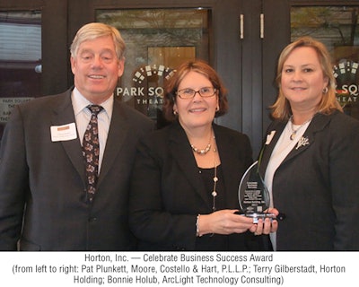 Terry Gilberstadt, center, accepted the Celebrate Business Success Award on Horton's behalf at the awards ceremony in September.
