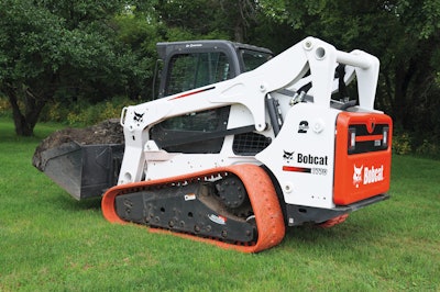 T770 With Non Marking Turf Tracks Hauling Dirt Resized