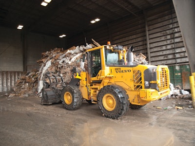 A Volvo wheel loader takes care of the rubbish.