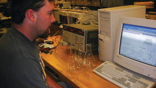 An engineering student tests the contamination levels