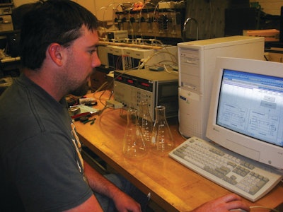 An engineering student tests the contamination levels