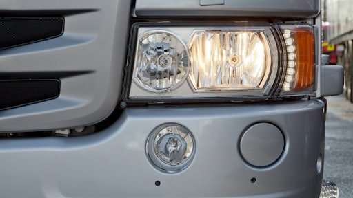 Scania's new H7 headlight with the LED daytime running lights in use.