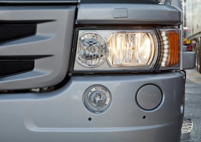 Scania's new H7 headlight with the LED daytime running lights in use.
