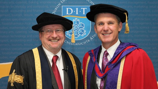 Topcon’s Ray O’Connor (right) receives honorary doctorate from Professor Brian Norton.
