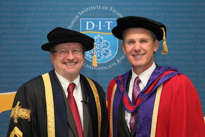Topcon’s Ray O’Connor (right) receives honorary doctorate from Professor Brian Norton.