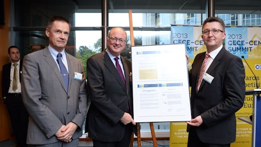 Gilles Dryancour, President of CEMA (left) and Johann Sailer, President of CECE (far right), present Malcom Harbour, MEP (center) with the associations' 10-point action plan for strenthening industrial production in Europe.