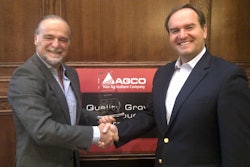 Stefano Bettinelli (left), Trelleborg OE Director Worldwide Agricultural & Forestry Tires, receiving the award from Josip T. Tomasevic (right), Vice President, AGCO Global Purchasing and Materials.