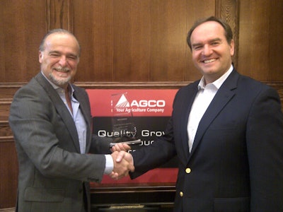 Stefano Bettinelli (left), Trelleborg OE Director Worldwide Agricultural & Forestry Tires, receiving the award from Josip T. Tomasevic (right), Vice President, AGCO Global Purchasing and Materials.