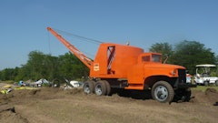 A restored 1947 Schield Bantam M47 truck dragline works at the HCEA's 2011 International Convention and Old Equipment Exposition at Penfield, IL. The truck's cab has been modified to allow the boom to be fully lowered during travel and storage.