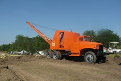 A restored 1947 Schield Bantam M47 truck dragline works at the HCEA's 2011 International Convention and Old Equipment Exposition at Penfield, IL. The truck's cab has been modified to allow the boom to be fully lowered during travel and storage.