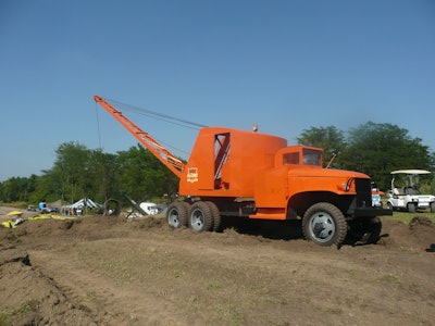 A restored 1947 Schield Bantam M47 truck dragline works at the HCEA's 2011 International Convention and Old Equipment Exposition at Penfield, IL. The truck's cab has been modified to allow the boom to be fully lowered during travel and storage.