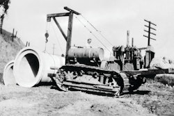 The problems involved in placing pipe with an end boom are illustrated by this rather crude rig, designed by R. G. LeTourneau for a Cat Sixty and used by his construction company on the grading contract for Southern Pacific Railroad's Carquinez Bridge approach in Benicia, CA, in 1929. Ballasted by sandbags, it provided ample capacity for a single section of pipe, but was unable to carry long strands along the trench.