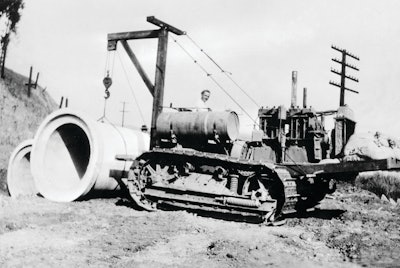 The problems involved in placing pipe with an end boom are illustrated by this rather crude rig, designed by R. G. LeTourneau for a Cat Sixty and used by his construction company on the grading contract for Southern Pacific Railroad's Carquinez Bridge approach in Benicia, CA, in 1929. Ballasted by sandbags, it provided ample capacity for a single section of pipe, but was unable to carry long strands along the trench.