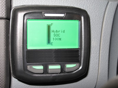 A display screen in the vehicle cab shows the state of charge for the system's lithium-ion batteries provided by Johnson Controls.