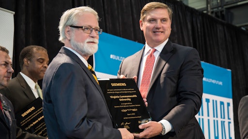 Executive Associate Dean, L. Franklin Bost, MBA, IDSA, with Siemens USA President and CEO Eric Spiegel.