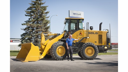 Todd Dokken, Sales Manager at Westcon Equipment and Rentals, shows off the LG938L, one of the several wheel loader models the new SDLG dealer will be offering.