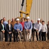 Scott Maki, Al Northquest and Randy Reinke of Custom Products (L to R wearing hard hats) with representatives of DEED, Minnesota Chamber of Commerce, City of Litchfield, Litchfield Chamber of Commerce, Bremer Bank and Systems West.