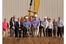 Scott Maki, Al Northquest and Randy Reinke of Custom Products (L to R wearing hard hats) with representatives of DEED, Minnesota Chamber of Commerce, City of Litchfield, Litchfield Chamber of Commerce, Bremer Bank and Systems West.