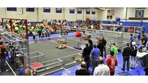 FIRST Robotics competitions are designed to be a sports-like atmosphere in which the student-built robots compete against one another by having to complete certain tasks in a 'pit.'