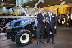 New Holland executives display the Tractor of the Year 2015 award in front of the T3F.