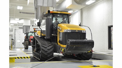A Challenger track tractor on the chassis dynamometer which tests for proper functioning of the steering, breaks and suspension system, as well as transmission shift quality, engine performance and other functional tests.