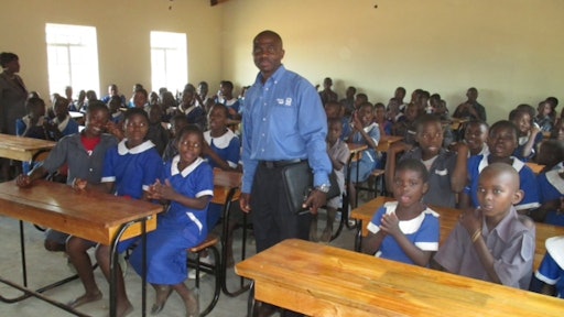 Bendix’s Martin M. M’Tambo recently returned to Kawale Primary School, which he attended as a young boy, to celebrate the completion of a classroom-construction project that he had conceived and directed under the auspices of Knorr-Bremse Global Care.