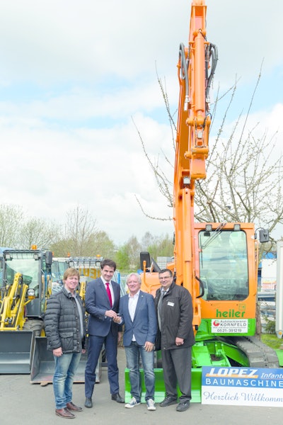 A Yanmar excavator in special green and orange painting was handed to Heiler in April 2015 (left to right Michael Heiler, Managing Director Heiler; Jean-Marc Reynaud, President Yanmar Construction Equipment Europe; Udo Heiler, Managing Director Heiler; and Manuel Lopez-Infantes, Managing Director Lopez-Infantes Baumaschinen).
