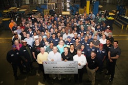 Employees at Meritor's Plainfield, IL, site present a check for $30,000 raised in the 'Shoes for Soldiers' campaign, which earmarked a percentage of its remanufactured brake shoe sales to the Wyakin Warrior Foundation.