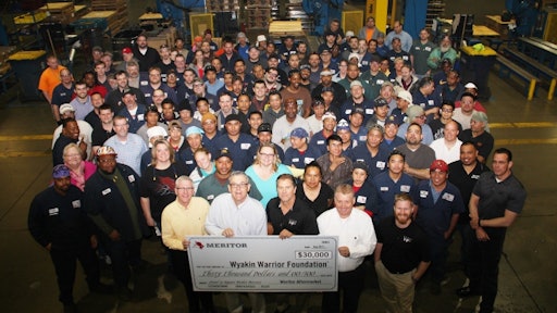 Employees at Meritor's Plainfield, IL, site present a check for $30,000 raised in the 'Shoes for Soldiers' campaign, which earmarked a percentage of its remanufactured brake shoe sales to the Wyakin Warrior Foundation.