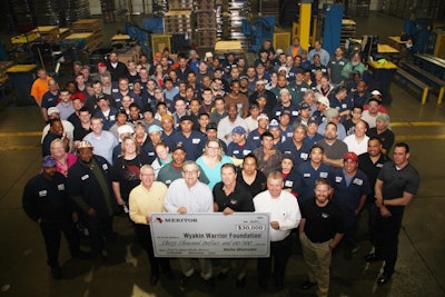 Employees at Meritor's Plainfield, IL, site present a check for $30,000 raised in the 'Shoes for Soldiers' campaign, which earmarked a percentage of its remanufactured brake shoe sales to the Wyakin Warrior Foundation.