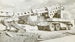A Warner & Swasey G1000 Gradall demonstrates the telescopic excavator’s ability to break up and remove pavement.