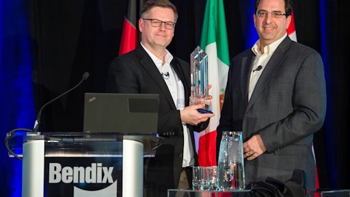 Berend Bracht, President and CEO at Bendix Commercial Vehicle Systems, accepts the Navistar Diamond Supplier award from Pat Morello, Navistar’s Director of Chassis Procurement.