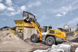 The Liebherr L 556 XPower wheel loader with industrial lift arms and high-dump bucket in test operation at a recycling business.