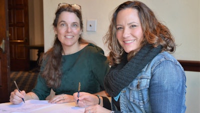 Sigrid de Vries, CECE Secretary General (left), and Megan Tanel, AEM Senior Vice President, sign CECE International Exhibition Partnership Programme agreement during AEM’s recent annual conference of member companies.