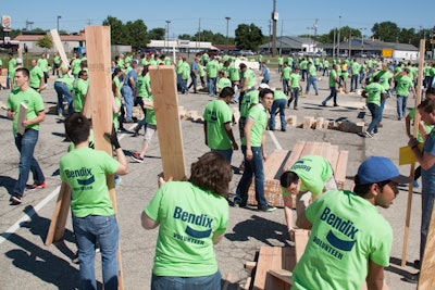 Nearly 500 Bendix volunteers gathered at the company’s headquarters in Elyria June 24, building frames for four Habitat for Humanity homes.