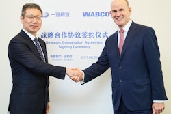 Pictured here are Hu Hanjie, General Manager at FAW Jiefang Automotive Company (left) and Jacques Esculier, Chairman and Chief Executive Officer at WABCO.
