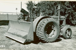 The ancestor of all wheel dozers is this diminutive machine, a John Deere D farm tractor outfitted in 1936 with an experimental blade designed by R. G. LeTourneau.