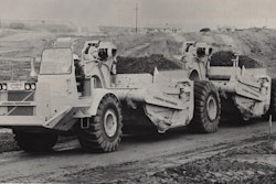 A LeTourneau-Westinghouse C-500 prime mover with two unpowered scrapers.
