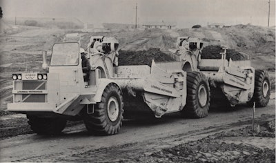 A LeTourneau-Westinghouse C-500 prime mover with two unpowered scrapers.