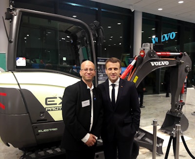 From left: Ahcène Nedjimi, Electromobility Specialist and EX2 Project Leader at Volvo Construction Equipment, discussed the company's prototype, fully-electric EX2 compact excavator with the French President, Emmanuel Macron.