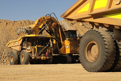 The Cat 793F autonomous trucks at loading.
